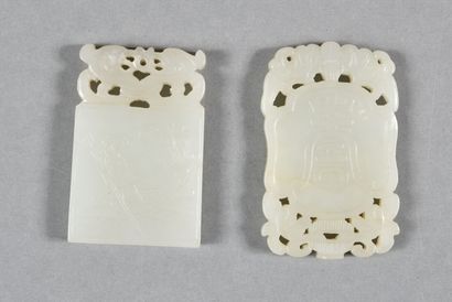 null Two white celadon jade rectangular pendants, one decorated with peaches on one...