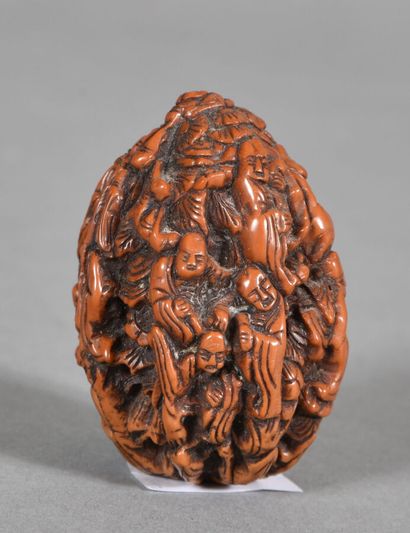 Patinated nut, carved with eighteen luohan....