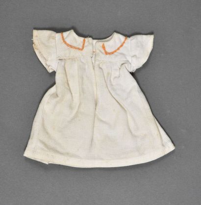 null White smocked dress (orange and green), 1946 GL. The collar of the dress is...