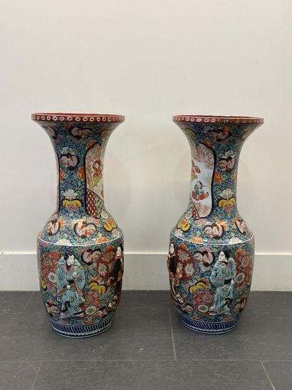 null A pair of large polychrome enameled porcelain vases with high necks and pavilion...