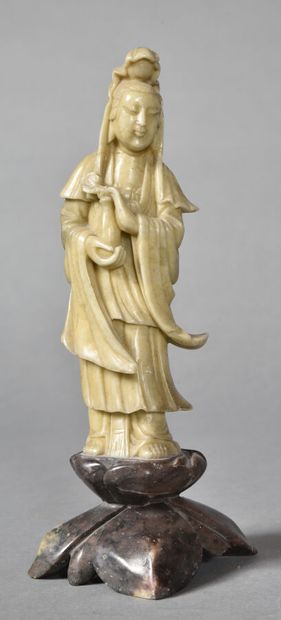 null Beige soapstone subject representing the goddess Guanyin, the vase of lustral...