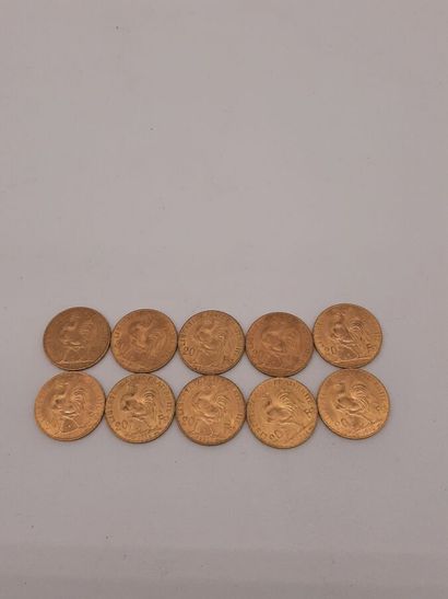 10 pièces de 20 francs or, type Coq.



A...