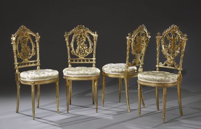 null Four lounge chairs in the Louis XVI style in gilded carved wood, openwork backs...