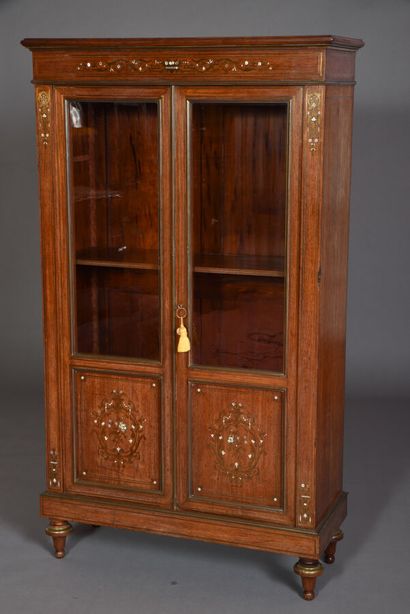 null Display case in rosewood veneer inlaid with fillets and cut brass drawing foliage...