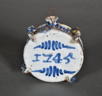null NEVERS or ROUEN.

Circular flattened flask with four loops with decoration in...