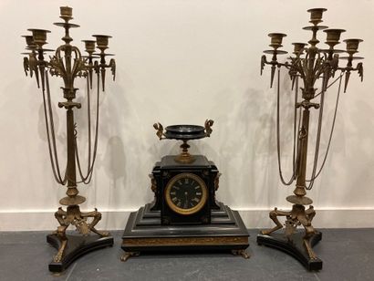null Black marble and gilt bronze mantel set including a clock topped by an antique...