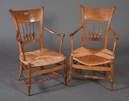 null Pair of armchairs in fruitwood, backs with bars, turned legs, straw seats. 

19th...