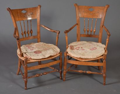 null Pair of armchairs in fruitwood, backs with bars, turned legs, straw seats. 

19th...