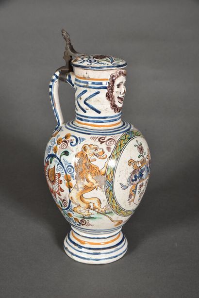 null GERMANY - FRIEDBERG.

Covered earthenware pitcher of baluster shape with long...