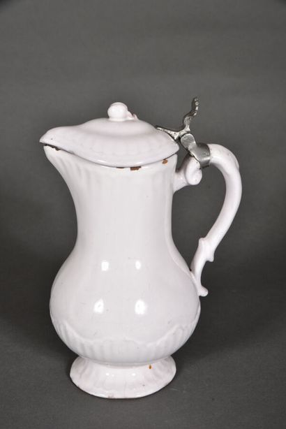 null White earthenware ewer of baluster form, metal pusher. 

Late 18th-early 19th...