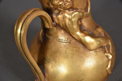 null Alexandre CHARPENTIER (1856 - 1909)

Gilt bronze pitcher with small spout and...