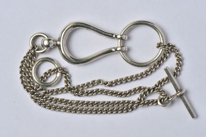 null Silver bracelet (800/oo) with double row of curb chain, holding in its center...