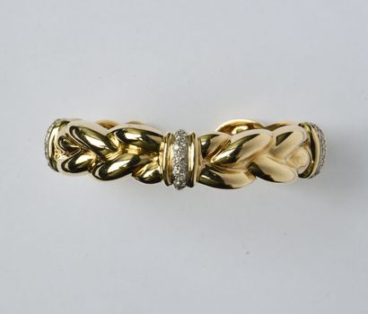 Bracelet rigide ouvert et articulé en or...