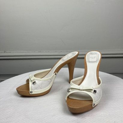 null CHRISTIAN DIOR. Pair of open-toe mules in white patent quilted leather with...