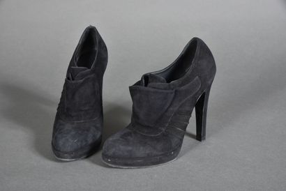 null YVES SAINT LAURENT. Pair of black suede low boots with flap effect on the vamp,...