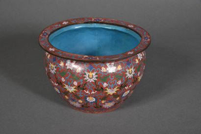 null A copper and polychrome cloisonné enamel basin on a red background, decorated...