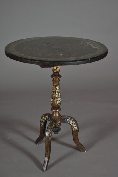 Wooden pedestal table with a circular top,...