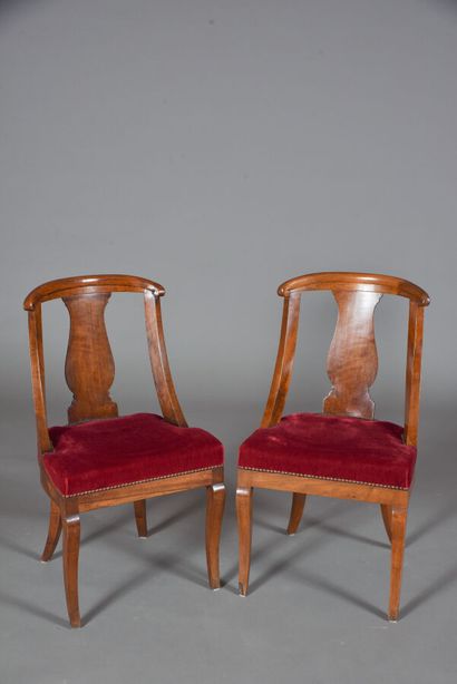 null Pair of walnut gondola chairs with openwork backs, trimmed with a central bar...
