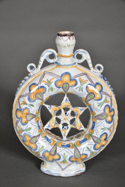 null Annular flask on earthenware pedestal, detached handles, the center openwork...