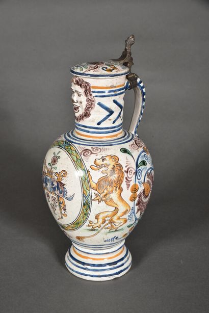 null GERMANY - FRIEDBERG.
Covered earthenware pitcher of baluster shape with long...