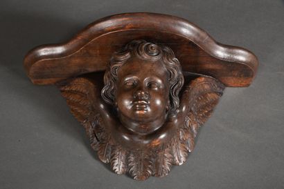 null Small wall bracket in carved wood representing an angel with spread wings. 
Around...