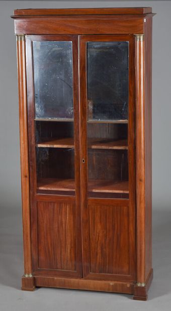 null Mahogany and mahogany veneer bookcase, opening with two leaves with glass and...