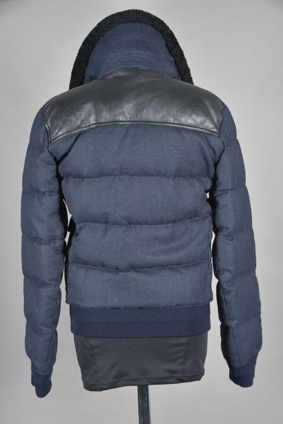 null BURBERRY. Blue quilted jacket with black leather-like shoulder yokes, black...