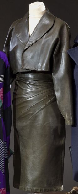 null Alaïa. Bronze lambskin leather outfit including a high-waisted knee-length skirt...