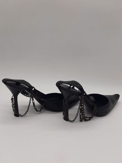 null PATRICK COX. Pair of black leather pumps, pointed toe, ankle embellished with...