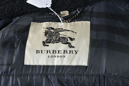 null BURBERRY. Blue quilted jacket with black leather-like shoulder yokes, black...