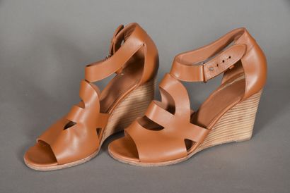 null HERMES Paris. Pair of camel leather cutout sandals with open toe and strap fastening...