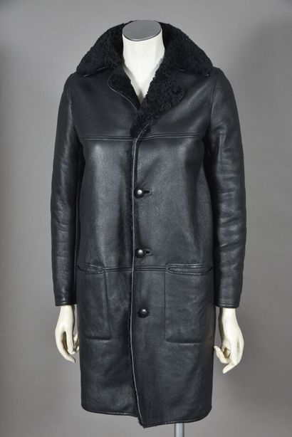 null SAINT LAURENT, by Anthony Vaccarello. Black shearling 7/8 coat, notched collar,...