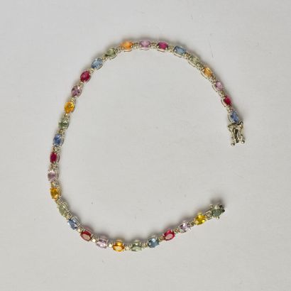 null Line bracelet in 18K white gold (750/oo) composed of multicolored sapphires...
