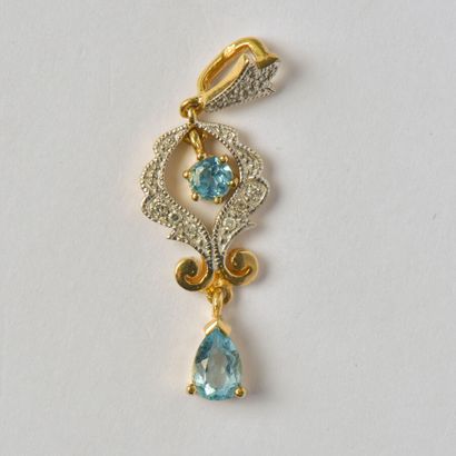 null Articulated pendant in 18K (750/oo) gold with round diamonds and blue stones...