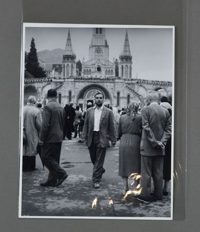 null [Yves KLEIN]. Harry SHUNK. Yves Klein in Front of the Basilica of Lourdes. B&W...