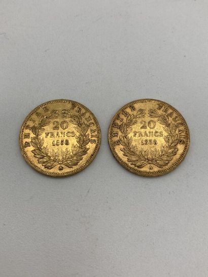 null Deux pièces de 20 francs or Napoléon III tête nue 1858. 
LOT VENDU SUR DESIGNATION,...