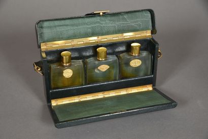 null COTY, 1920s 
Poplar travel box covered with Moroccan paper containing three...