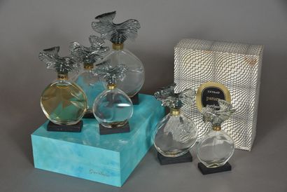 null GUERLAIN, "Parure", 1975
A series of six colorless glass bottles molded in the...