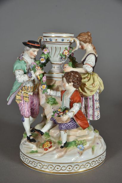 null Porcelain subject with polychrome decoration animated by three characters. Marked...