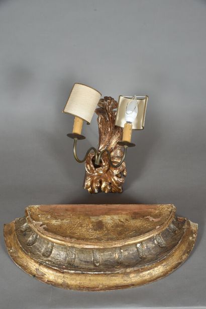 null A gilded wood element, mounted with two later light arms and a gilded carved...