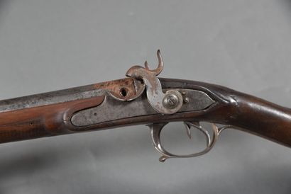null 2-shot shotgun, with modified flintlock percussion caps, stock carved with a...