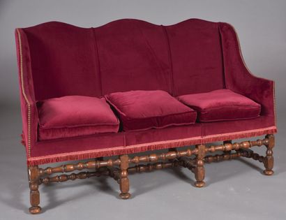 Upholstered basket sofa, resting on eight...