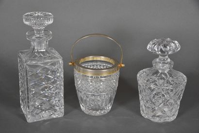 Two crystal and glass decanters and an ice...