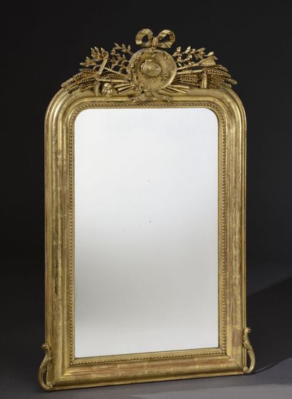 Wood and gilded stucco mirror, molded and...