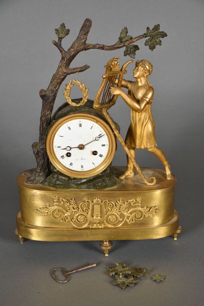 Patinated and gilded bronze clock symbolizing...