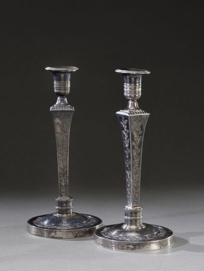 null Pair of candelabras, sheathed shafts engraved with foliage, Medici-shaped binnacles,...