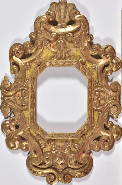 Large gilded carved wood frame in the form...