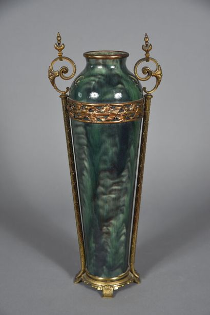 Vase in the form of a green jaspered ceramic...