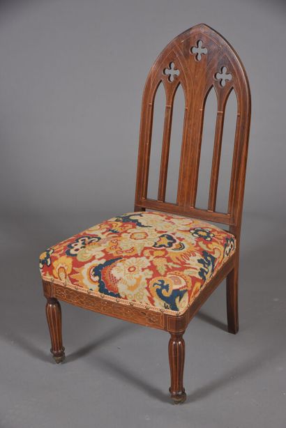 Low chair in rosewood veneer and light fillets,...