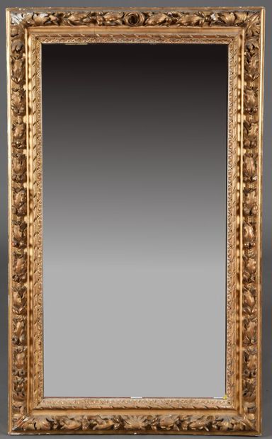 Large carved wood mirror, framed with braided...